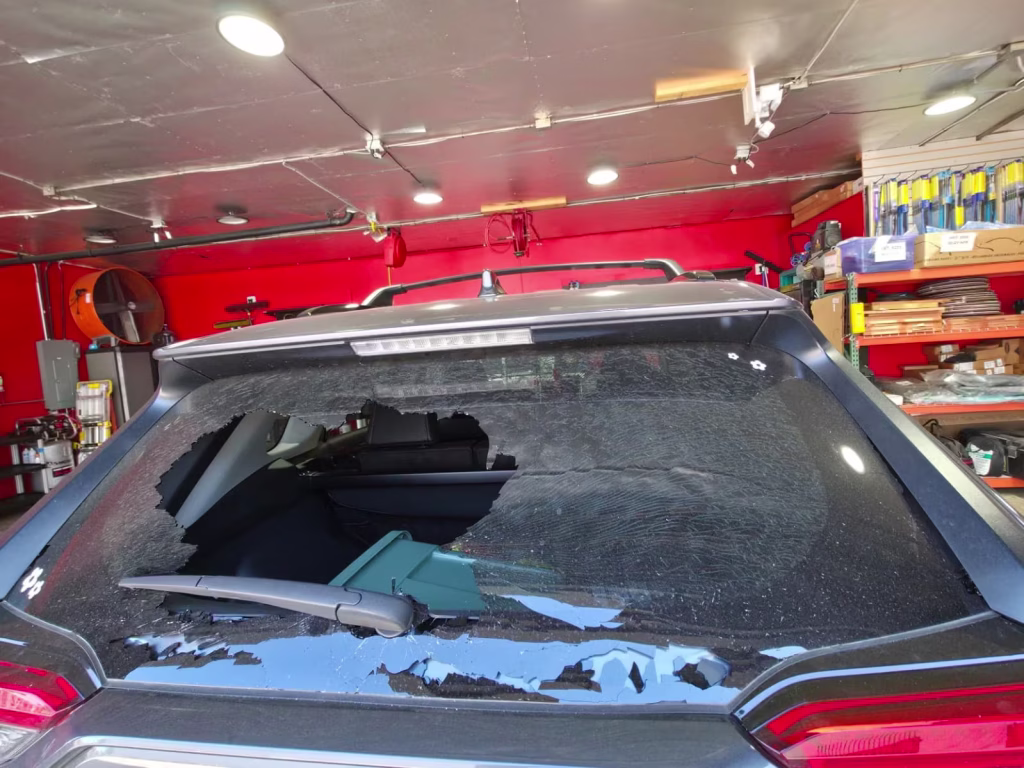 Shattered rear windshield on SUV needing replacement in Orange County
