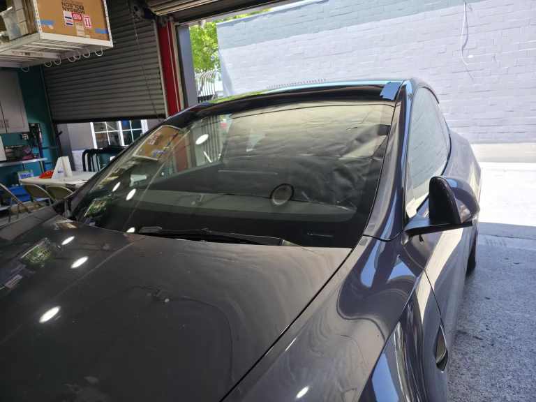 Completed Tesla windshield replacement at an auto glass shop